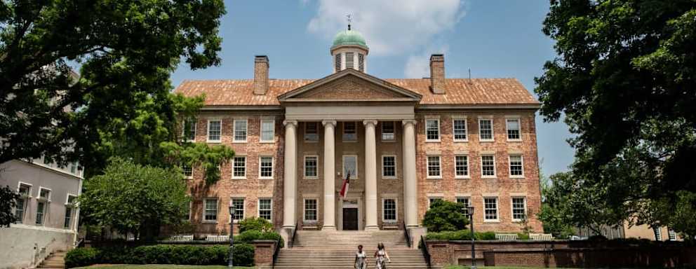 People walk on the campus of the University of North Carolina Chapel Hill on June 29, 2023.