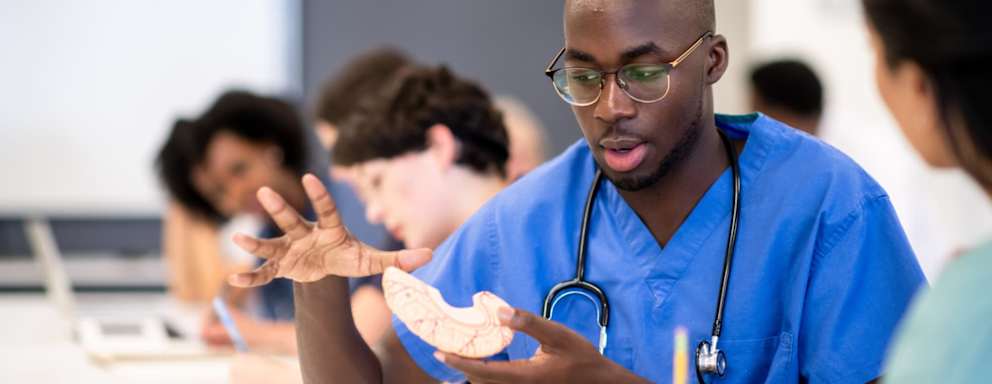 Nursing students taking notes in class