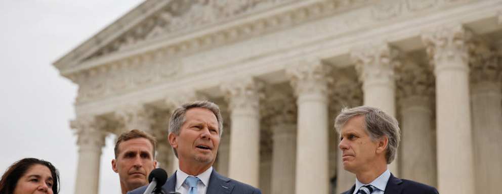 Kevin Guskiewicz talking in front of Supreme Court building