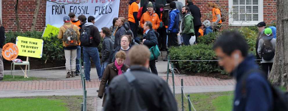 Protestors block the main entrance to the Harvard University President's office, calling for an open meeting with Harvard's governing body about fossil fuel divestment.