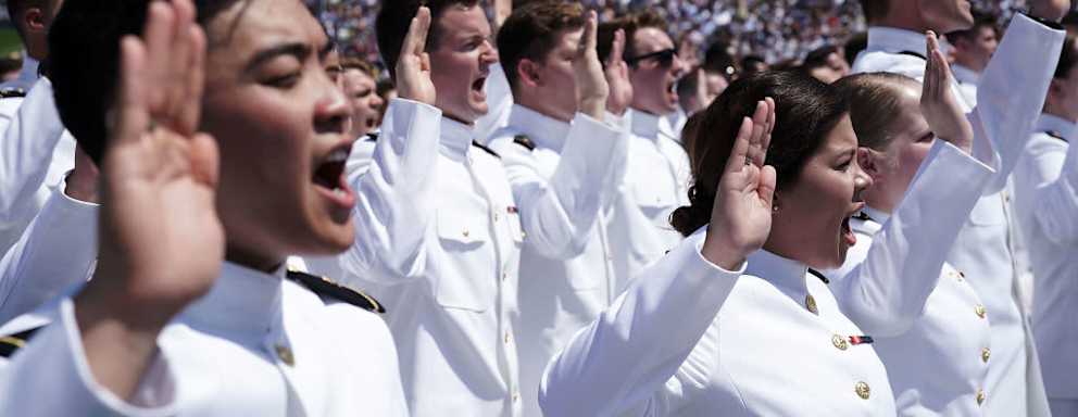 Naval Academy graduates reciting oath at ceremony