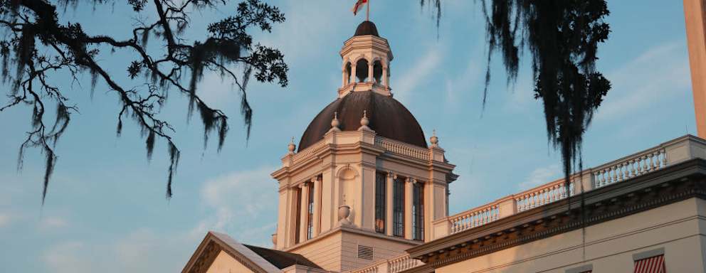 Sunset over the exterior of the historic Florida Capitol Building in Tallahassee, Florida.