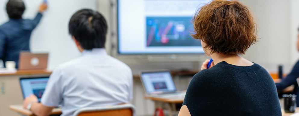 Mid adult woman in a continuing education class at a community college or university