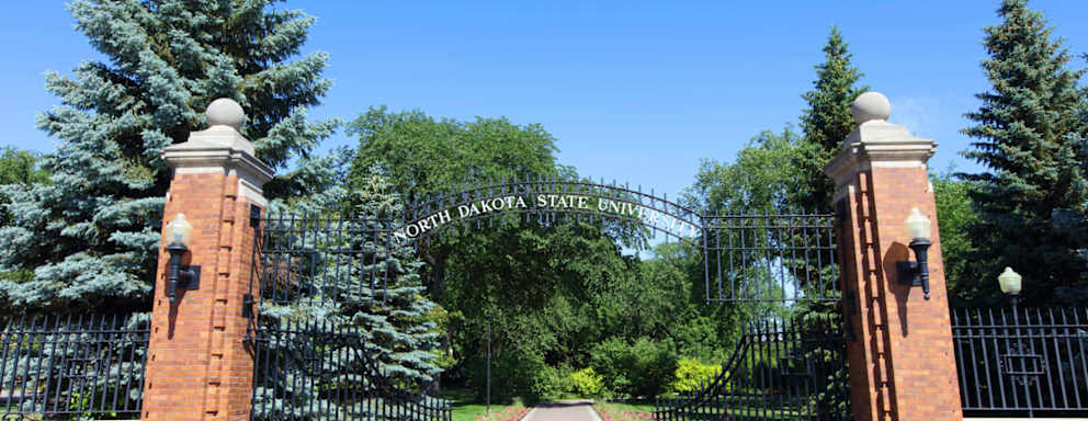 Daytime view of North Dakota State University entrance sign along N University Dr