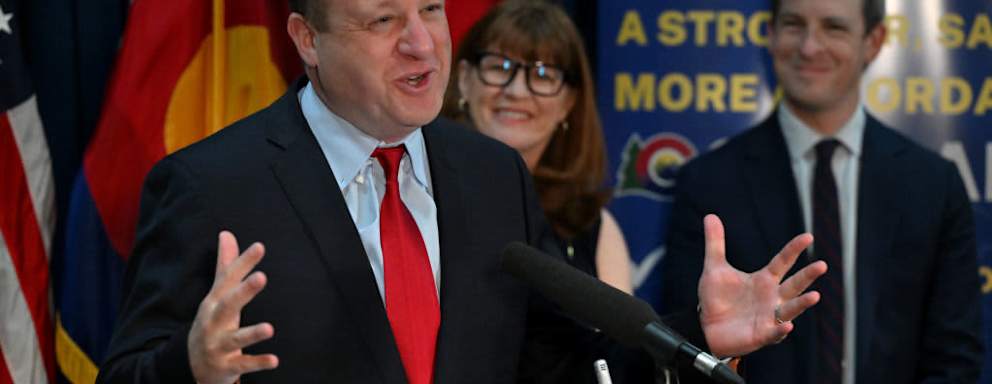 Colorado Governor Jared Polis speaks to members of the press during a press conference in the Governors office after the 2024 Legislative session at the Colorado State Capitol in Denver on May 9, 2024. Behind him are Julie McCluskie, Speaker of the House, and Steve Fenberg, President of the Senate. The Governor and the legislative leadership as well as the different caucuses of the Colorado legislature held post-session press conferences to discuss their accomplishments from the Legislative session.