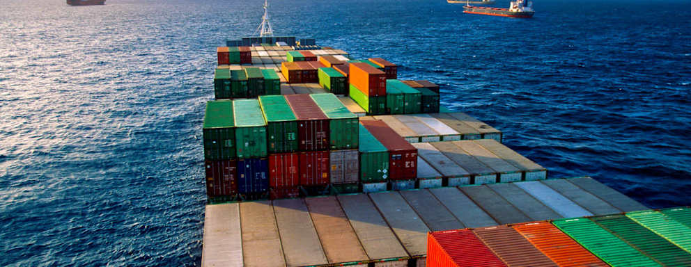 The container vessel Panamax transporting cargo across the open sea near Colon en route to the Panama Canal.