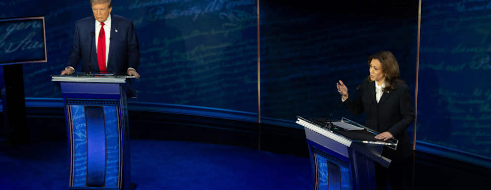 US Vice President and Democratic presidential candidate Kamala Harris and Republican presidential candidate Donald Trump speak on the debate podium during the ABC News US Presidential Debate on September 10, 2024.