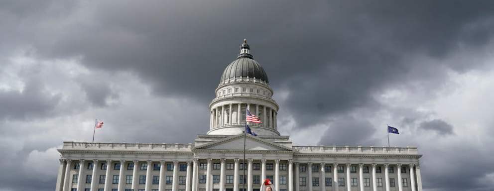 A woman photographs the Utah State Capitol as protesters rally in support of Roe v. Wade and abortion rights on May 3, 2022, in Salt Lake City, Utah.