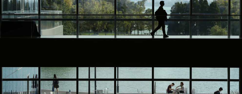 Students at Northwestern University's Kellogg School of Management gather Monday, Oct. 8, 2018, at the school's campus in Evanston. Administrators across the nation increasingly fear their schools may not reopen for the fall semester.