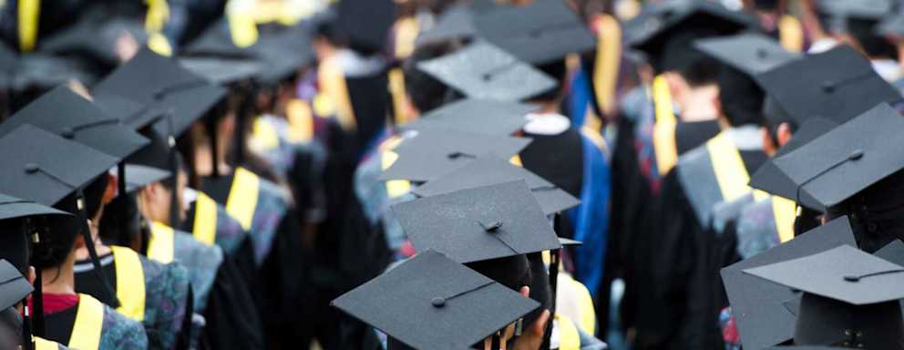 Shot of graduation caps during commencement.