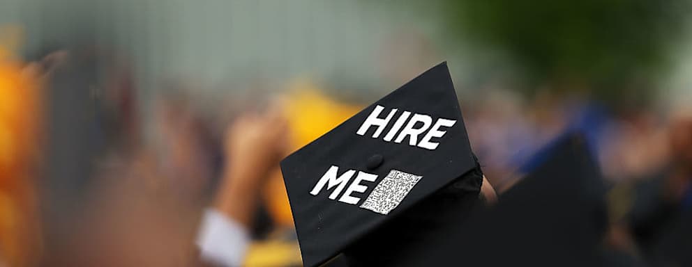 A graduating student's cap declares their future intentions during commencement exercises at City College
