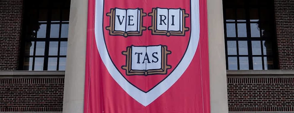 Harvard University's Veritas shield on a banner