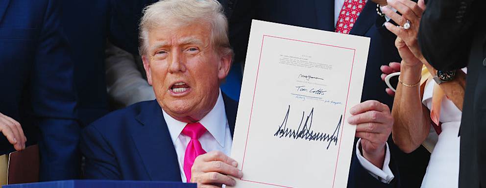 S President Donald Trump displays the signed bill during a ceremony for the One Big Beautiful Bill Act on the South Lawn of the White House in Washington, DC, US, on Friday, July 4, 2025. Trump signed his $3.4 trillion budget bill into law Friday, enshrining an extension of tax cuts, temporary new breaks for tipped workers and funding to crack down on illegal immigration.