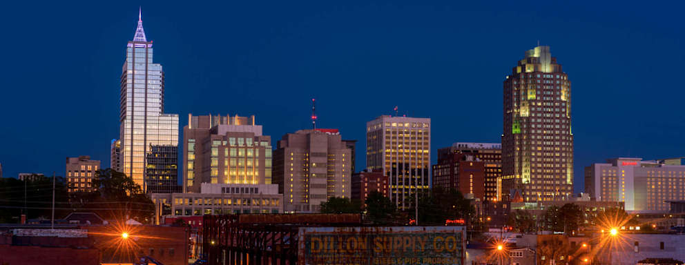 Skyline of Raleigh, NC during summer at dusk"n