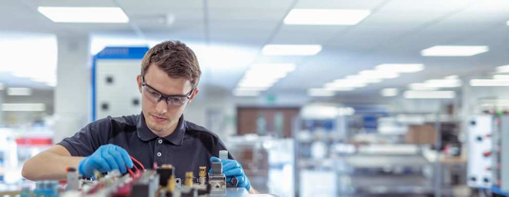 Apprentice engineer in medical electronics machinery manufacturing factory