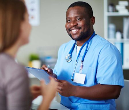 Nurse speaking to patient