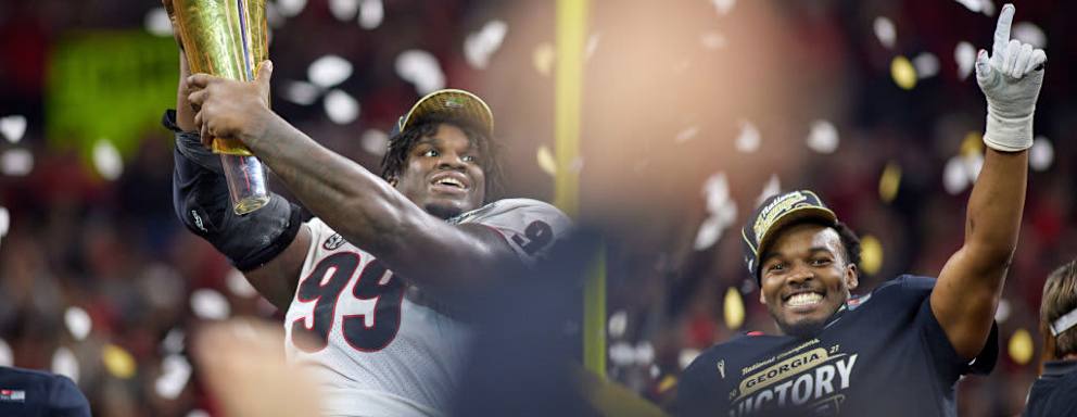 Georgia Bulldogs placekicker Jared Zirkel holds up and celebrates with the championship trophy after the College Football National Championship playoff game between the Alabama Crimson Tide and the Georgia Bulldogs on January 10, 2022.