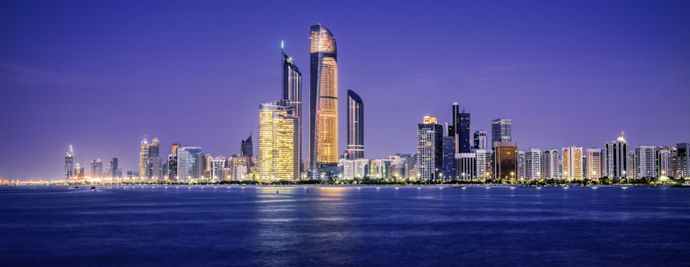 Illuminated nighttime skyline of Abu Dhabi