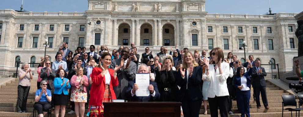 ST. PAUL, MN. - MAY 2023: Along with DFL legislative leaders and his commissioners, Minnesota Gov. Tim Walz threw a ceremonial budget bill-signing party Wednesday morning on the State Capitol steps.