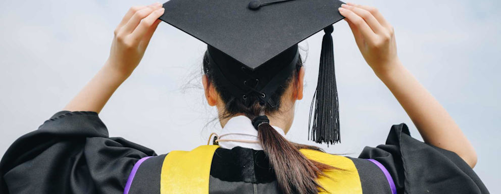 Student Wearing Graduation Gown