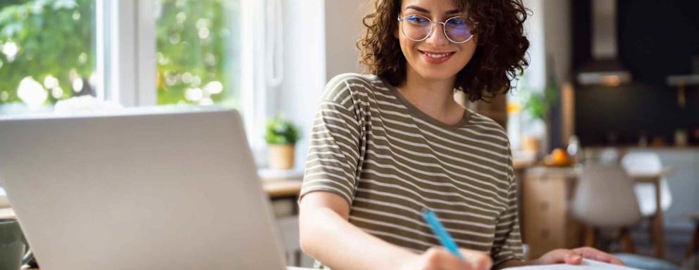 Young woman, a university student, studying online.