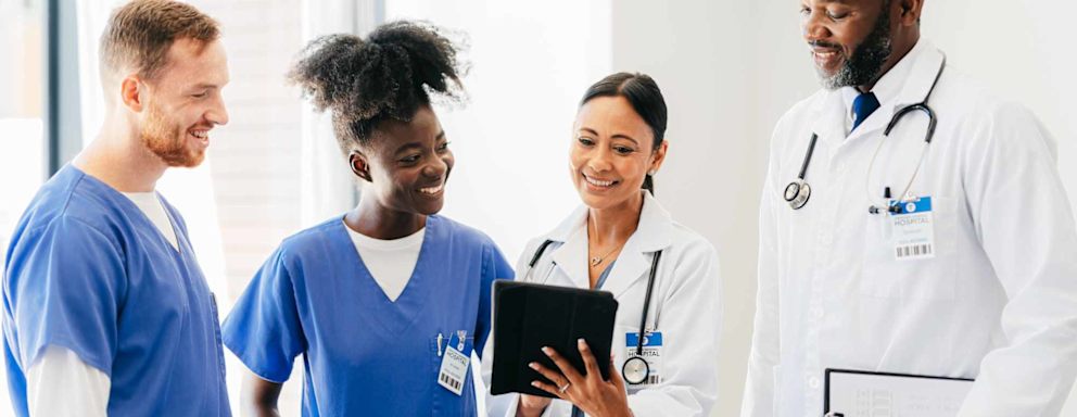 Healthcare team looking at tablet together