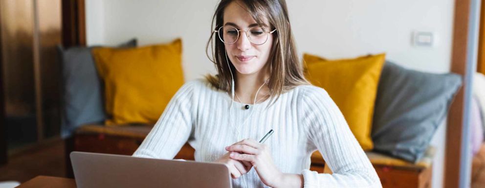 Student woman during E-Learning on laptop at home