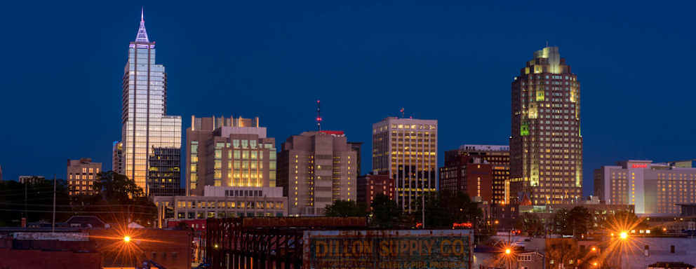 Skyline of Raleigh, NC during summer at dusk"n