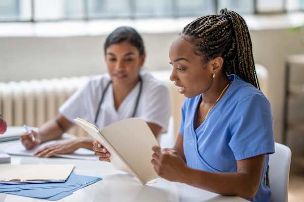 Two nursing students studying together