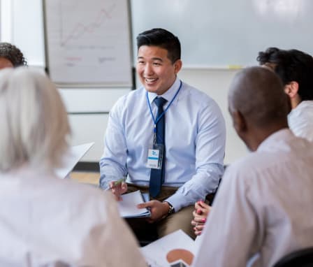 Public health professional speaking to doctors