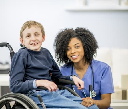 A child with special needs due to chromosome 8P inversion duplication syndrome with a nurse.