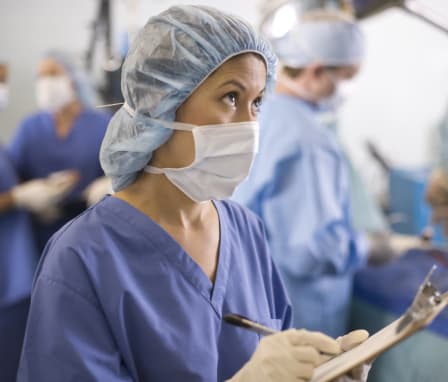 Nurse taking notes in surgical room