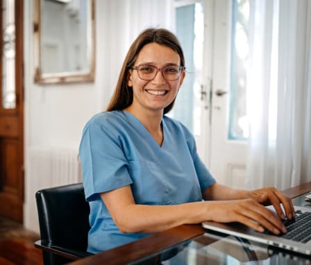 Nurse typing on a computer