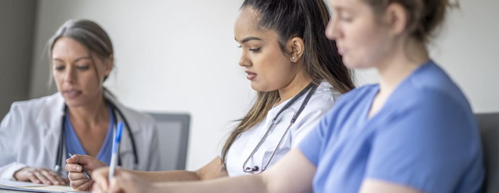 Nurses taking notes in a training