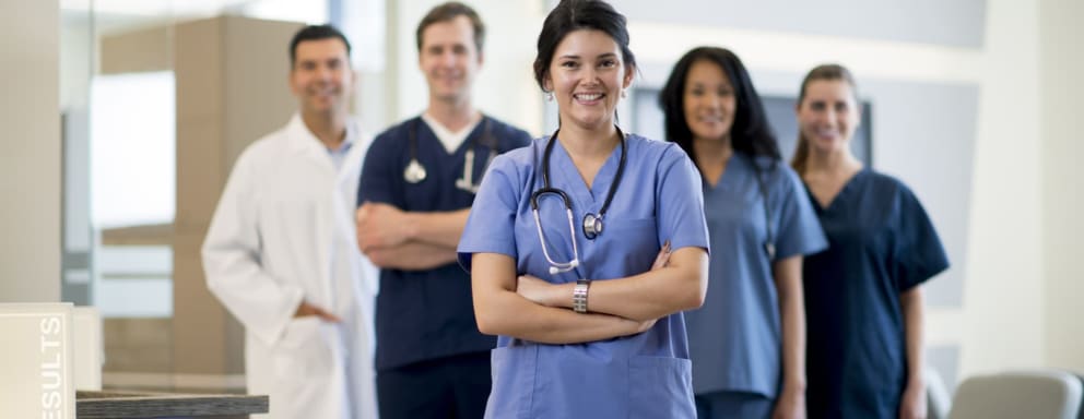 Group nurses standing together and smiling