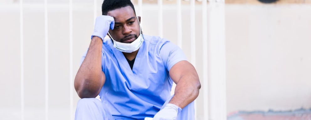 Tired nurse taking a break outside