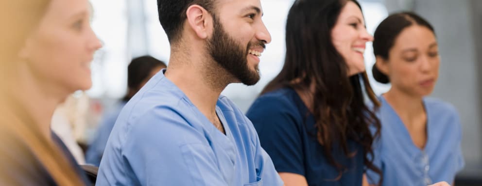 Nursing students smiling in a classroom