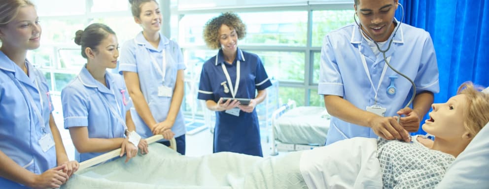 Nurses training with a mannequin