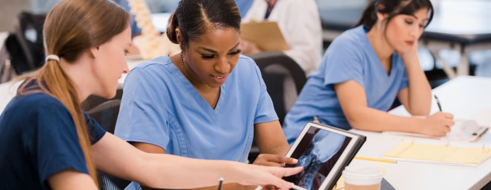 Nursing students looking at an x-ray in class