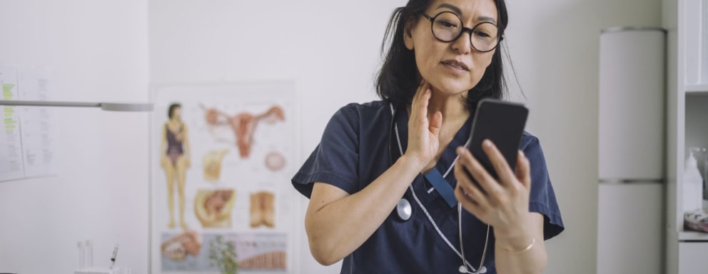 Nurse educator making video on smartphone