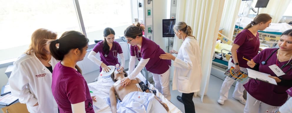 Nursing students working on patient simulation