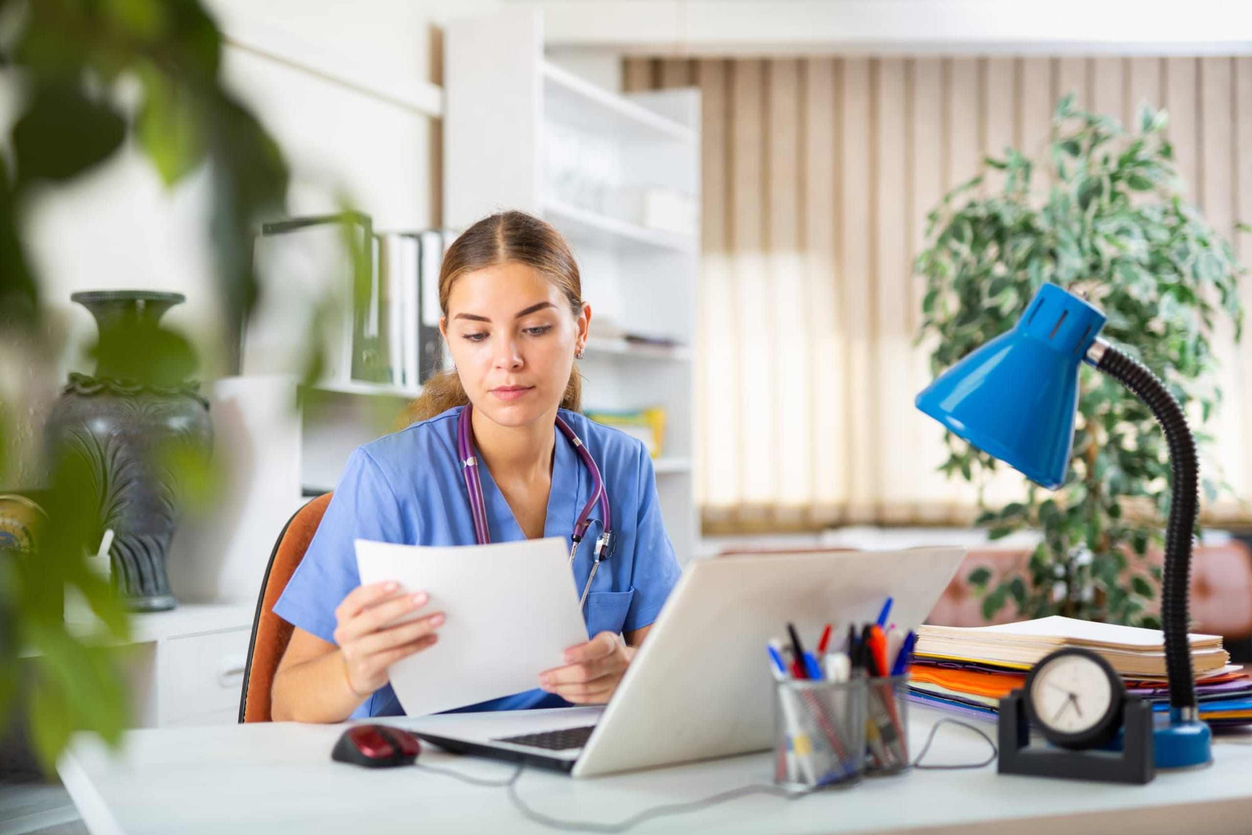 Nursing student searching for scholarships on a laptop