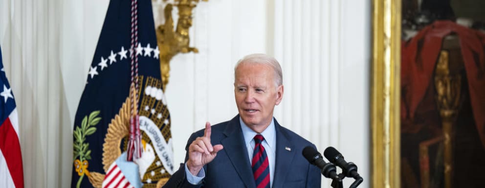 President Joe Biden speaking at a podium