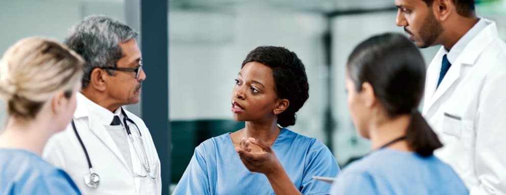 Nurses and doctors talking together