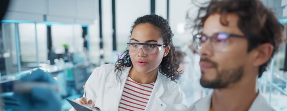 Scientists in medical research lab focusing