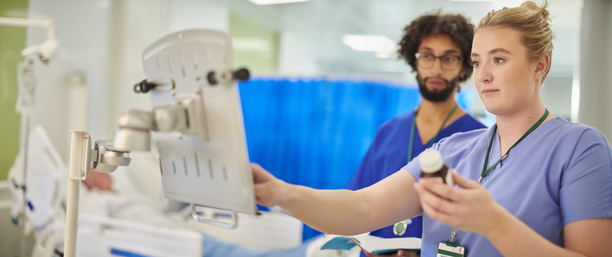 Nurse prescribing medication to patient