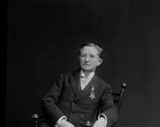 Black and white photo of Dr. Mary Walker sitting on a chair