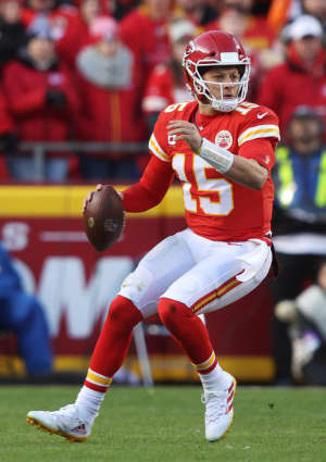 Patrick Mahomes runs with the ball in the AFC Championship Game between the Kansas City Chiefs and the Cincinnati Bengals on January 30, 2022 in Kansas City, Missouri..