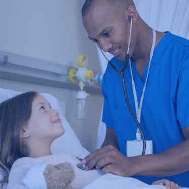 male nurse checking child patient with stethoscope