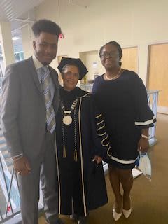 Déontae Guy with his mother and President Emeritus Shirley Collado.